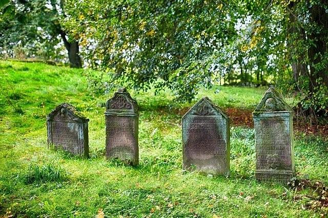 4 gravestones in a cemetery